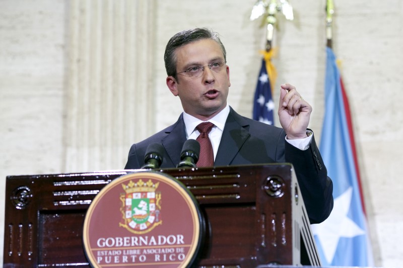 © Reuters. Puerto Rico's Governor Alejandro Garcia Padilla delivers his state of the Commonwealth address at the Capitol building in San Juan