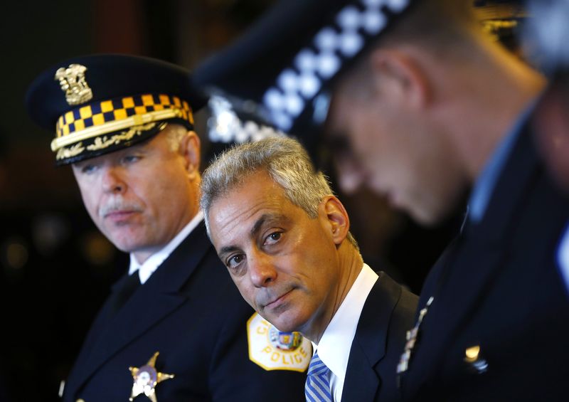 © Reuters. Chicago Police Superintendent McCarthy stands with Mayor of Chicago Rahm Emanuel (C) during a recruitment graduation ceremony in Chicago