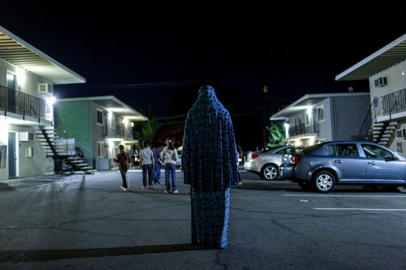 © Reuters. Syrian refugee Dania poses for a portrait at the Sacramento, California apartment complex she lives in.