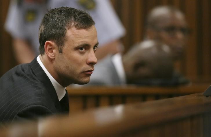 © Reuters. South African Olympic and Paralympic track star Oscar Pistorius listens to the verdict in his trial at the high court in Pretoria