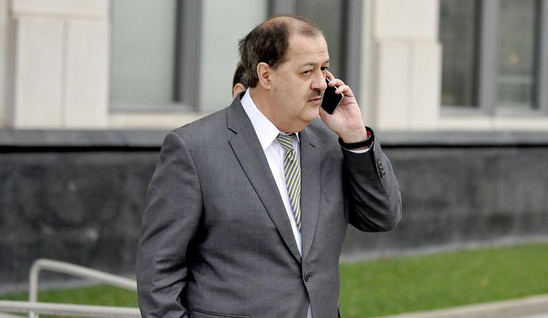 © Reuters. Former Massey Energy Chief Executive Don Blankenship is talking on his mobile phone as he walks into the Robert C. Byrd U.S. Courthouse in Charleston West Virginia