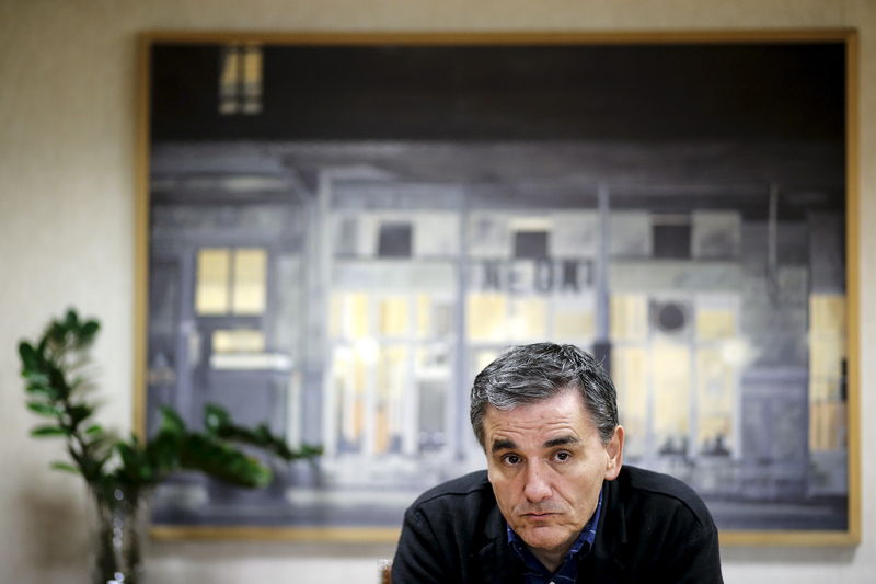 © Reuters. Greek Finance Minister Tsakalotos looks on during an interview with Reuters at his office in the ministry in Athens