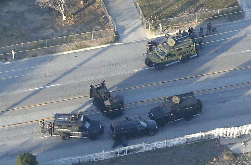 © Reuters. Aerial photo of an SUV with its windows shot out that police suspect was the getaway vehicle from at the scene of a shooting in San Bernardino, California