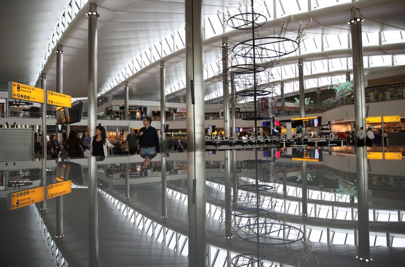 © Reuters. A view of the departure lounge is reflected in Terminal 2 at Heathrow Airport