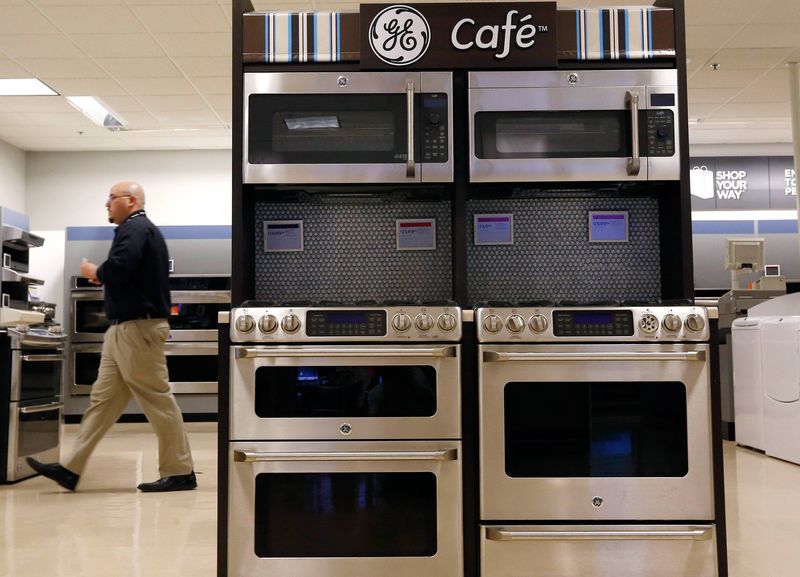 © Reuters. Sears employee walks past a display of General Electric appliances in Schaumburg in this file photo