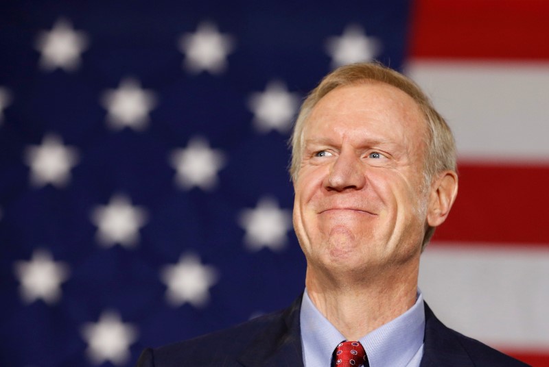 © Reuters. Republican Bruce Rauner smiles after winning the midterm elections in Chicago, Illinois