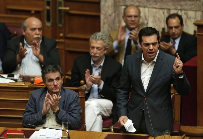 © Reuters. Greek Prime Minister Alexis Tsipras delivers his speech as he attends a parliamentary session in Athens