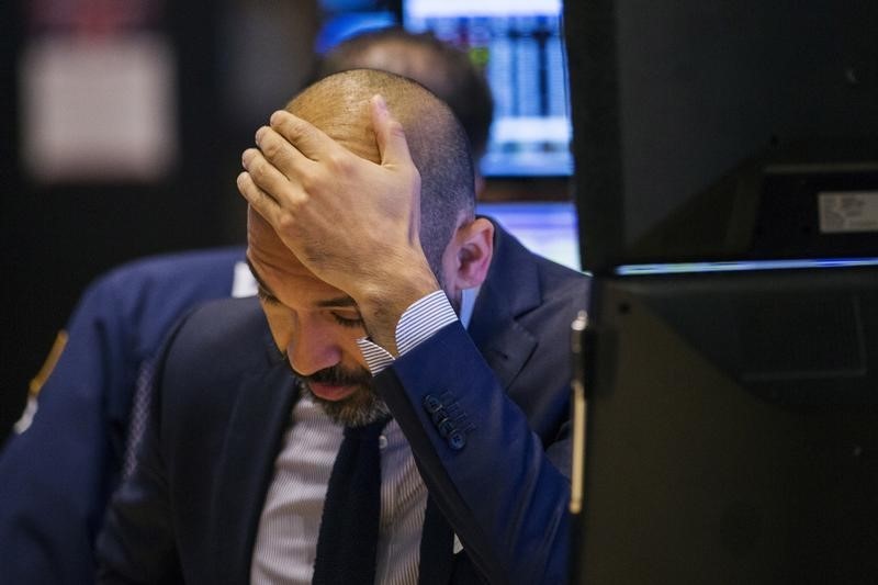 © Reuters. A trader works on the floor of the New York Stock Exchange shortly after the opening of the markets in New York