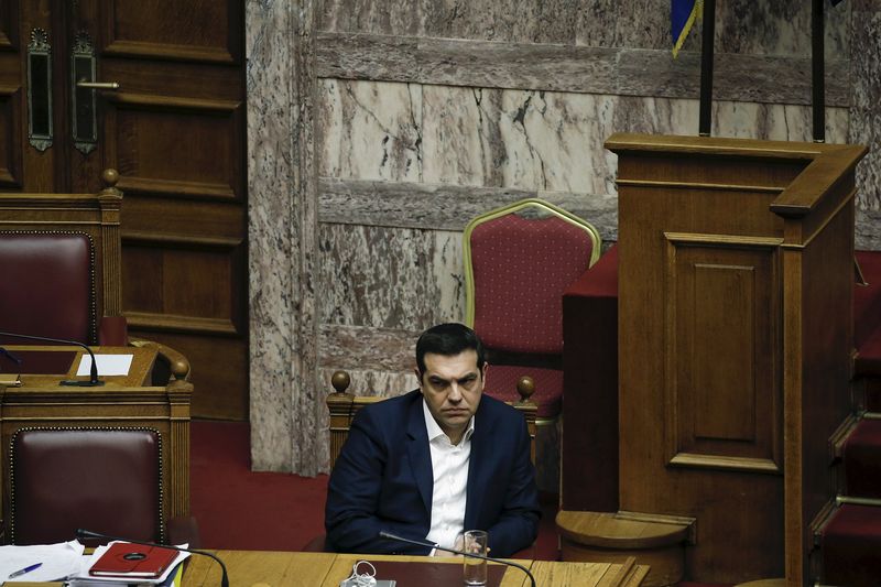 © Reuters. Greek PM Tsipras looks on during a parliamentary session before a budget vote in Athens