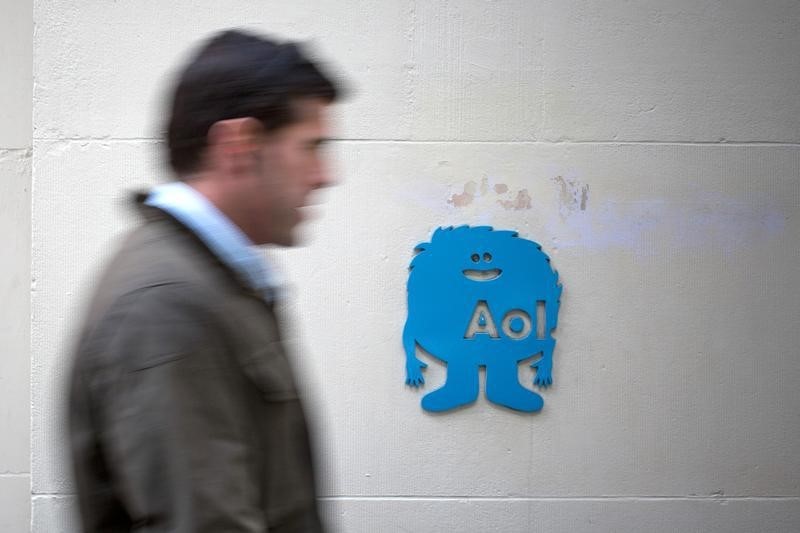 © Reuters. A man walks past the AOL logo at the company's office in New York