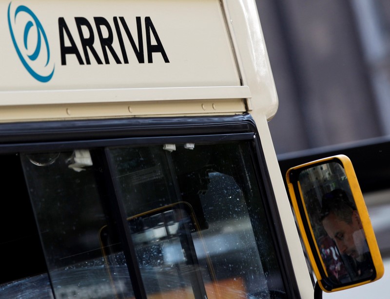 © Reuters. An Arriva driver is reflected in the mirror of his bus in Leicester