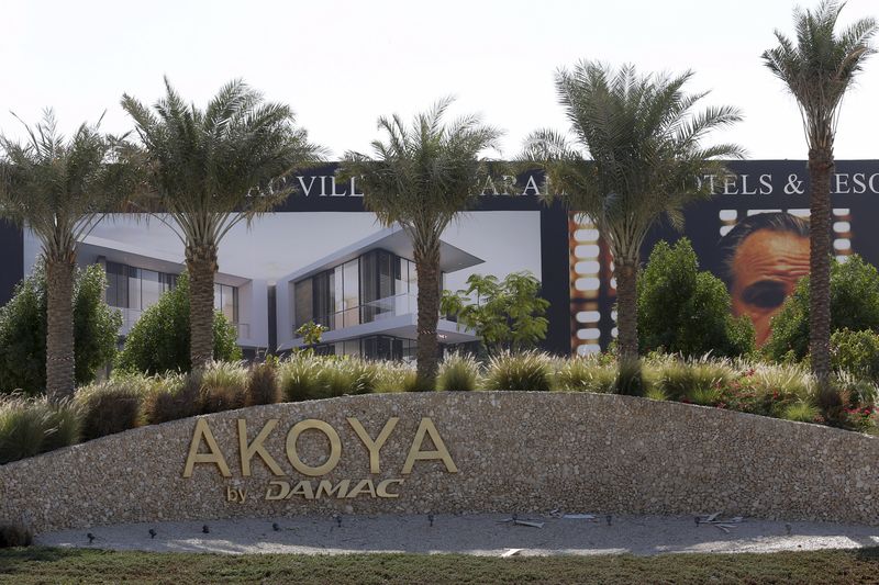 © Reuters. A view shows the signboard after the removal of the Trump International Golf Club portion at the AKOYA by DAMAC development in Dubai