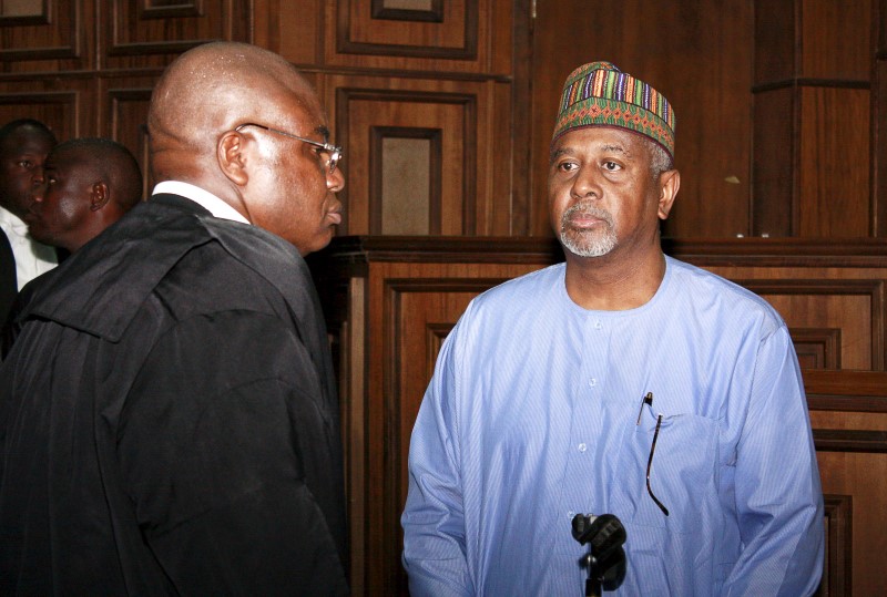 © Reuters. Former National Security Adviser Sambo Dasuki arrives with one of his counsels Ahmed Raji at the Federal High Court in Abuja