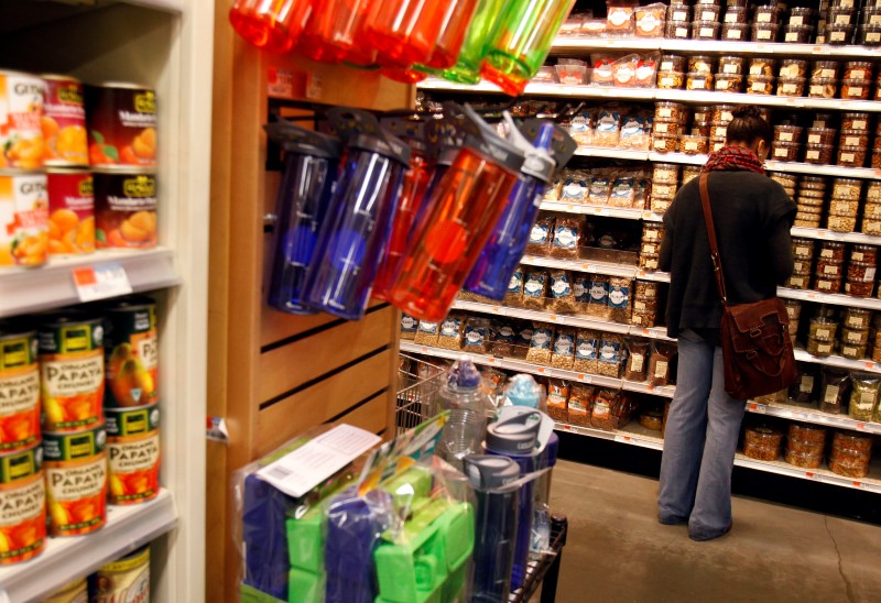 © Reuters. A woman shops for groceries at a Whole Foods supermarket in New York