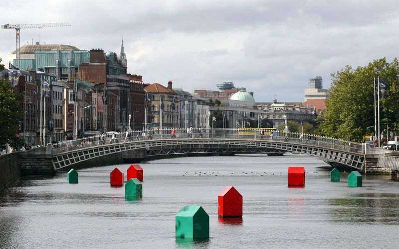 © Reuters. An art installation of Monopoly houses and hotels by Irish contemporary artist Fergal McCarthy floats on the river Liffey in Dublin