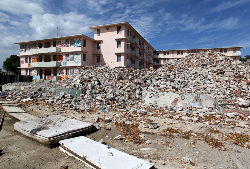 © Reuters. Debris is scattered around the government housing project Puerta de Tierra which is undergoing renovation work, in San Juan