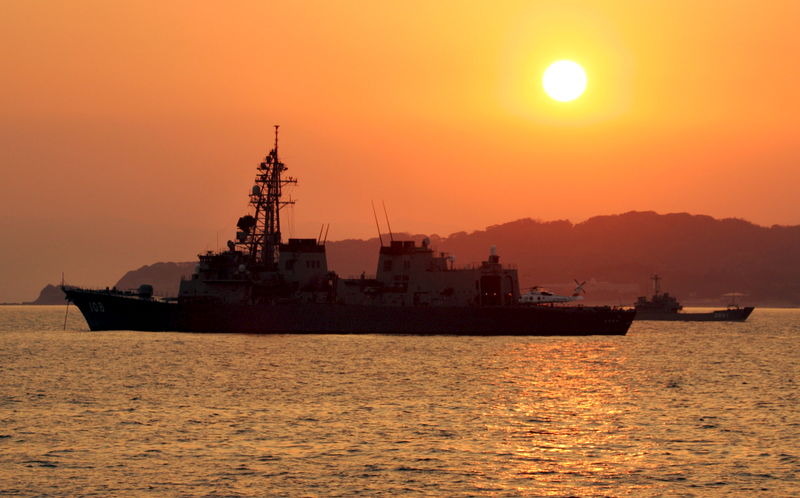 © Reuters. File photo of Japanese vessels off Genkaijima Island, Japan.