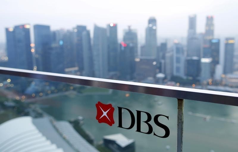 © Reuters. A DBS logo in pictured in the backdrop of the central business district in Singapore