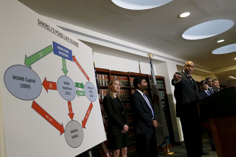 © Reuters. U.S. Attorney for the Eastern District of New York Capers points to a chart during a media briefing at the U.S. Attorney's Office of the Eastern District of New York in the Brooklyn borough of New York