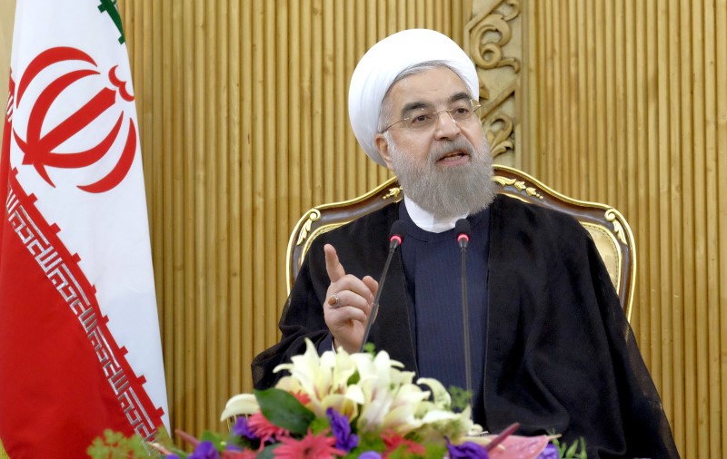 © Reuters. Iranian President Hassan Rouhani speaks after returning from the annual United Nations General Assembly, in Tehran 