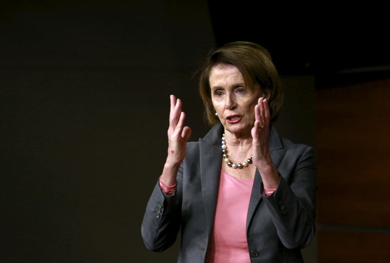 © Reuters. U.S. House Minority Leader Nancy Pelosi speaks at a news conference with members of the House Democratic leadership following the House vote on the Omnibus bill on Capitol Hill in Washington