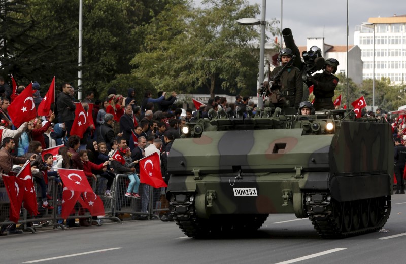 © Reuters. Turkish soldiers in an armored army vehicle take part in a Republic Day ceremony in Istanbul, Turkey