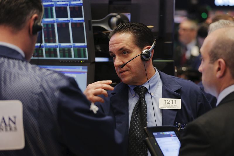 © Reuters. A trader works on the floor of the New York Stock Exchange (NYSE) shortly after the opening bell in New York