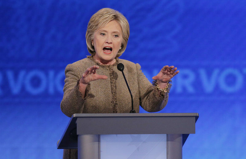 © Reuters. Democratic U.S. presidential candidate Clinton responds to a question about the potential use of U.S. ground troops to fight Islamic State during the Democratic presidential candidates debate at St. Anselm College in Manchester