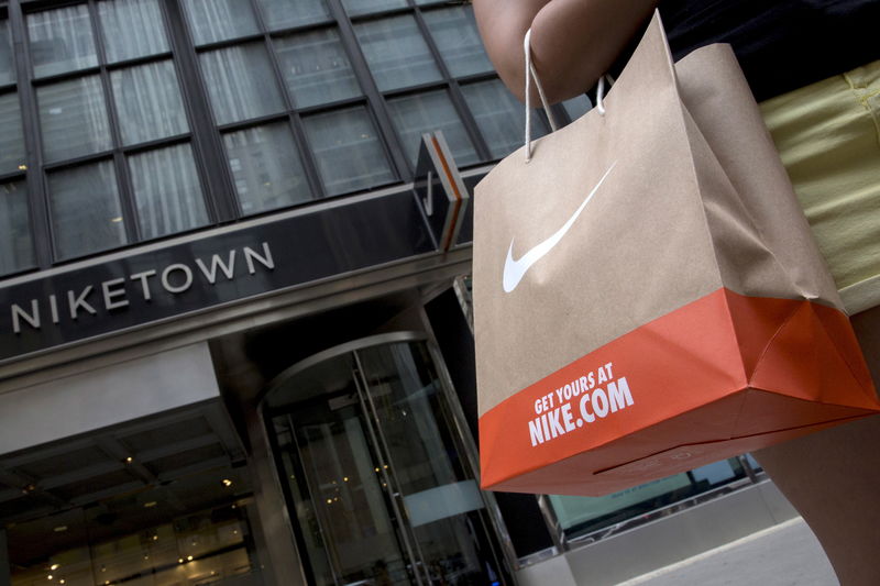 © Reuters. File photo of a customer exiting the Niketown store in midtown Manhattan in New York