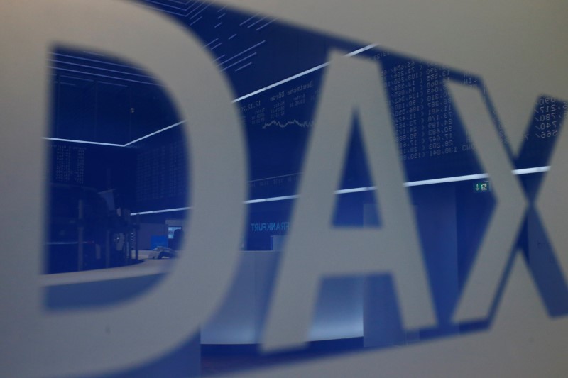© Reuters. The DAX Index curve is mirrored in a DAX logo on the trading floor of Frankfurt stock exchange