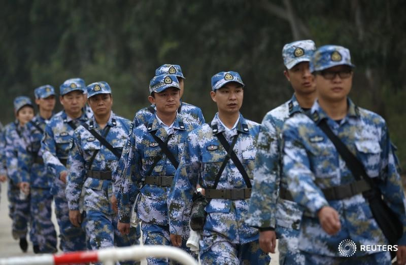 © Reuters. الصين تطالب الشركات الحكومية باستيعاب الجنود المسرحين