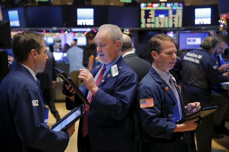 © Reuters. Traders work on the floor of the New York Stock Exchange shortly after the opening bell in New York