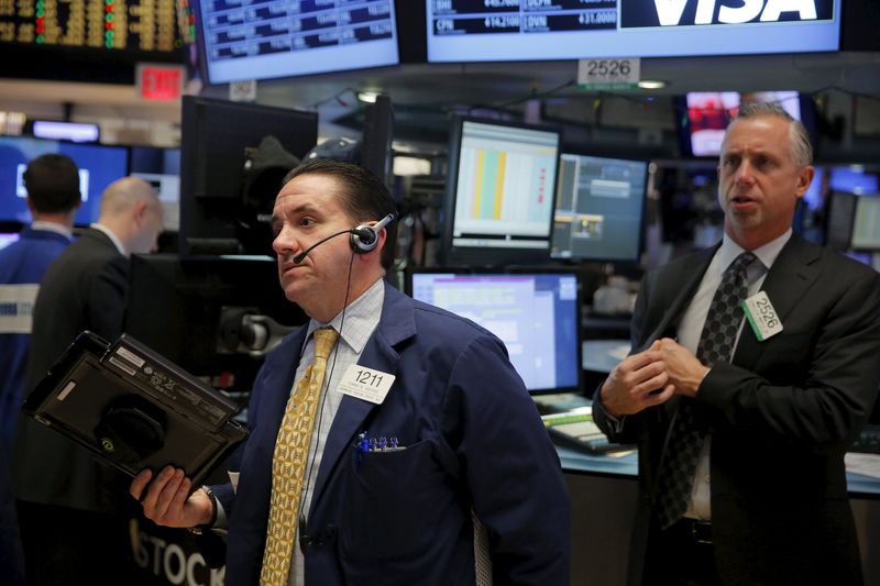 © Reuters. Traders work on the floor of the New York Stock Exchange shortly after the opening bell in New York