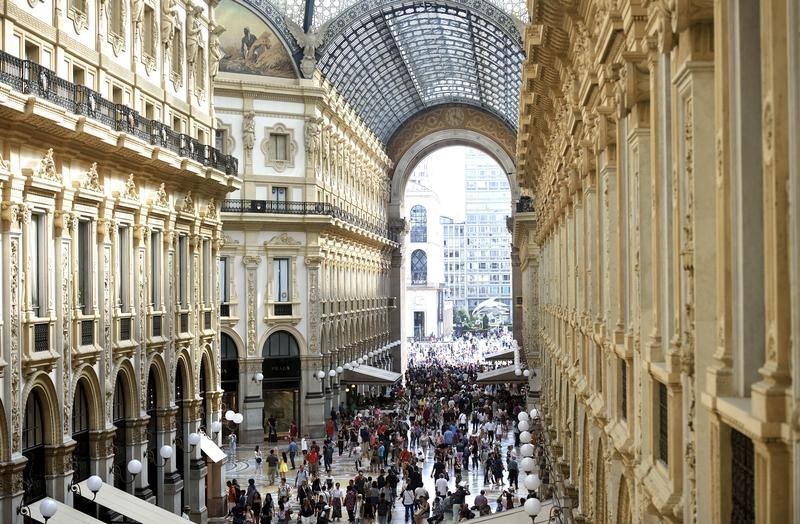 © Reuters. People walk along the Galleria Vittorio Emanuele II shopping mall in Milan