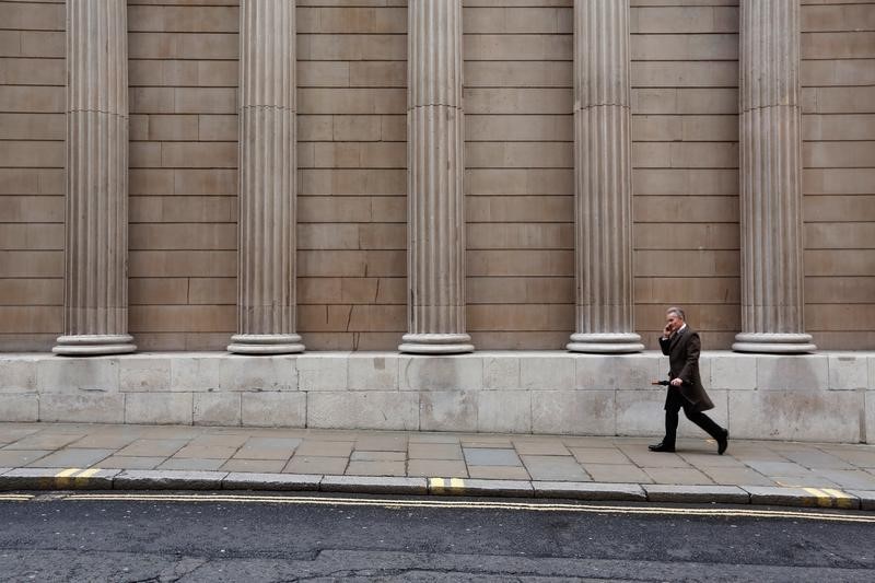 © Reuters. A man walks past the Bank of England in London, Britain  