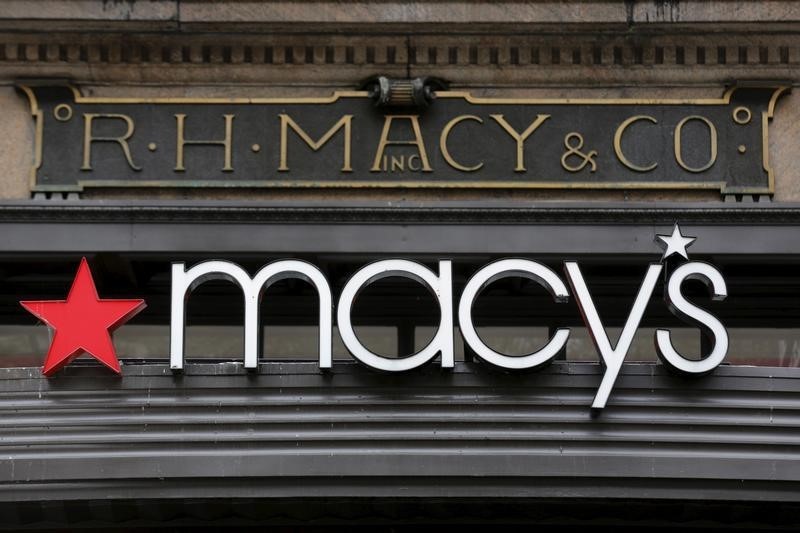 © Reuters. The R.H. Macy and Co. is seen over the logo for Macy's department store at the flagship store in New York