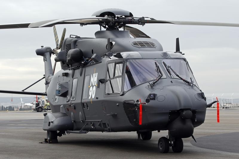 © Reuters. A NH90 helicopter is seen on the tarmac during a visit of France's Defense Minister to the European civil and military helicopter manufacturer Eurocopter in Marignane