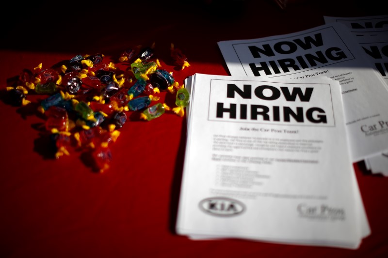 © Reuters. Leaflets lie on a table at a booth at a military veterans' job fair in Carson