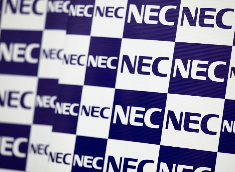 © Reuters. NEC Corp's logos are pictured during a news conference in Tokyo
