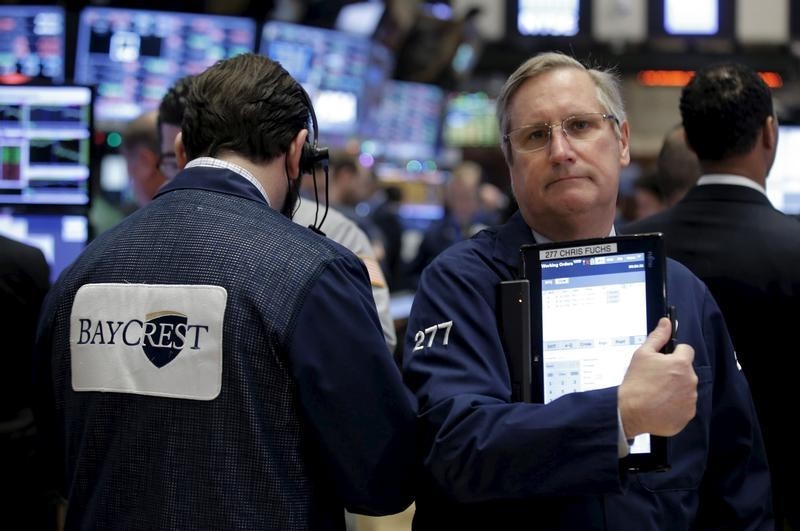 © Reuters. Traders work on the floor of the New York Stock Exchange (NYSE) shortly after the opening bell of trading session in New York