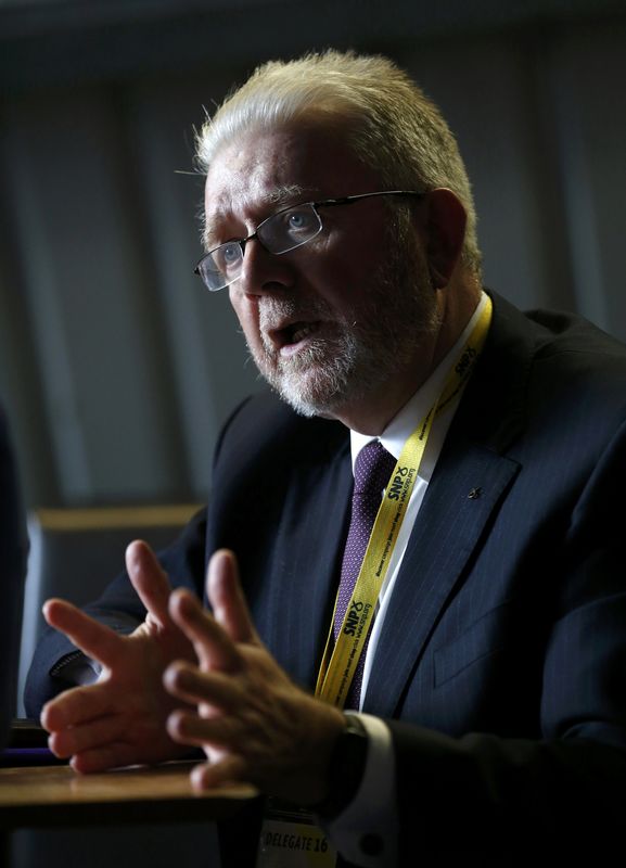 © Reuters. Michael Russell (MSP) Minister for UK Negotiations on Scotland's Place in Europe poses for a photograph during an interview on the sidelines of the Scottish National Party (SNP) conference in Glasgow