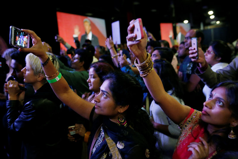 © Reuters. Attendees watch Trump speak at a Bollywood-themed charity event in Edison, New Jersey