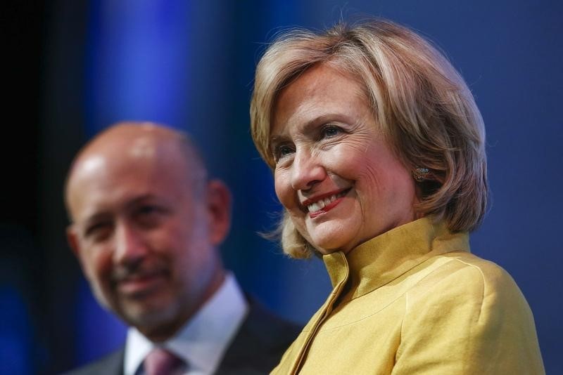 © Reuters. Former U.S. Secretary of State Hillary Clinton and Goldman Sachs Chairman and CEO Lloyd Blankfein listen to speakers during the "Equality for Girls and Women: 2034 Instead of 2134?" plenary session at the Clinton Global Initiative 2014 in New York