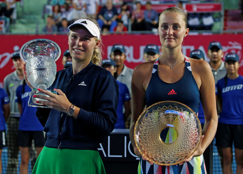 © Reuters. Tennis - Hong Kong Open final - Caroline Wozniacki of Denmark v Kristina Mladenovic of France