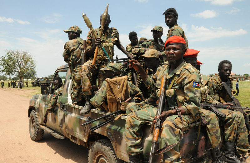 © Reuters. Sudan People's Liberation Army (SPLA) forces patrol the camp of Lalo, close to Malakal, South Sudan