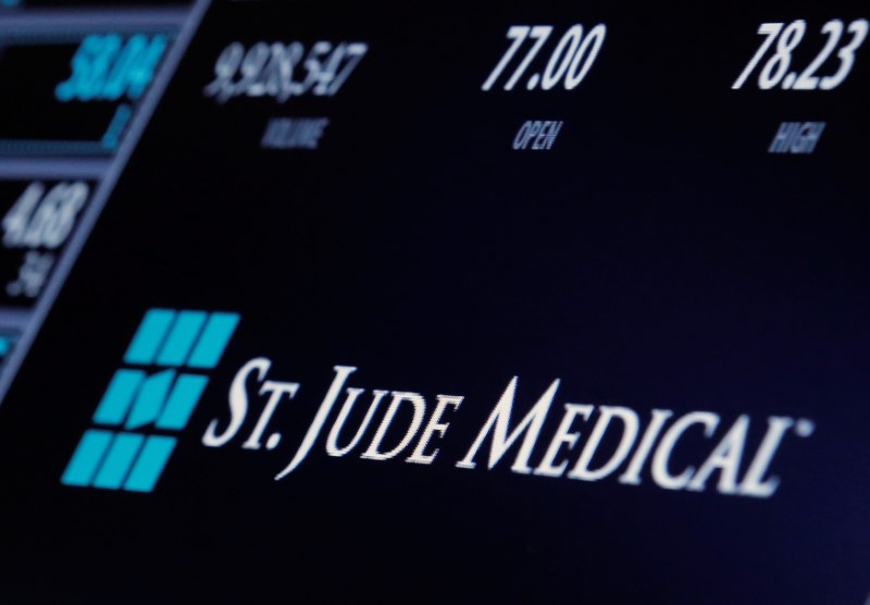 © Reuters. The ticker and trading information for St. Jude Medical is displayed where the stock is traded on the floor of the NYSE