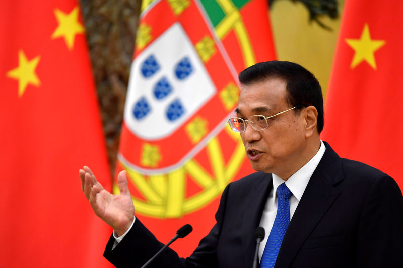 © Reuters. Chinese Premier Li Keqiang speaks during a joint news conference with Portuguese Prime Minister Antonio Costa at the Great Hall of the People in Beijing