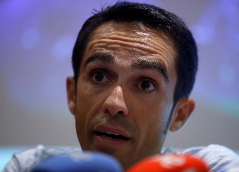 © Reuters. Contador of Spain attends a news conference after a medical examination following his multiple falls in the Tour de France