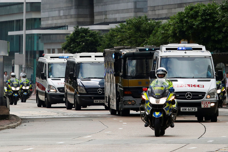 © Reuters. A motorcade taking British former banker Rurik Jutting to High Court in Hong Kong