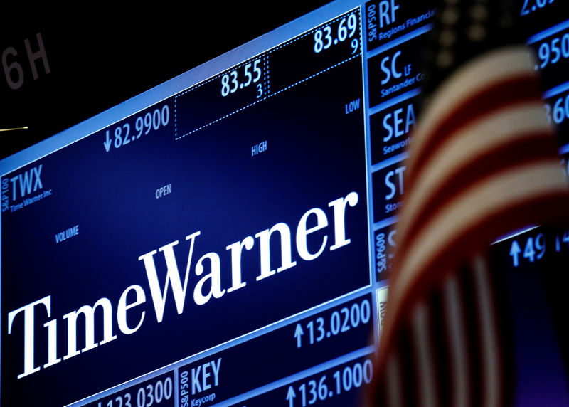 © Reuters. Ticker and trading information for media conglomerate Time Warner Inc. is displayed at the post where it is traded on the floor of the New York Stock Exchange in New York City